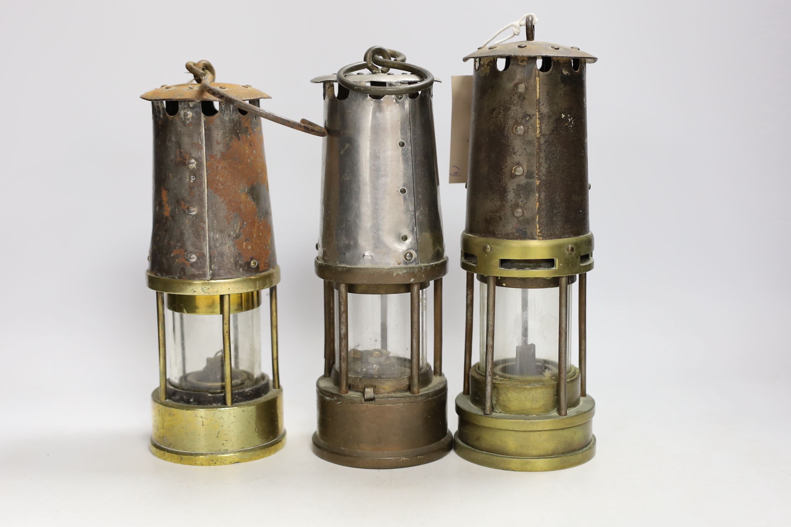 Three miner's lamps